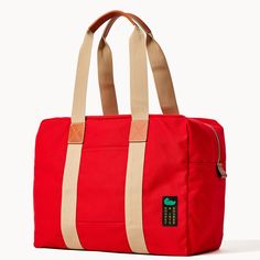 Travel in Style  With this travel-ready look, crafted from 100% Egyptian cotton canvas woven in Italy, you'll be able to pack for days at a time, so get ready to see the world in style. Red Rectangular Weekender Bag For Trips, Functional Red Travel Bag With Luggage Sleeve, Red Travel Bag With Luggage Sleeve For Daily Use, Red Rectangular Weekender Bag For Travel, Red Rectangular Weekender Travel Bag, Rectangular Red Weekender Bag For Travel, Rectangular Red Weekender Bag, Casual Red Bag With Luggage Sleeve, Red Travel Bags With Leather Trim