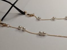 A practical and elegant accessory, this gold brass chain decorated with acrylic pearls is designed to keep your face mask or glasses safe. The length of the chain is 75 cm Protect them from water, perfumes, hair and body lotions to keep them bright and shiny for years. Accessoire pratique et élégant, cette chaîne en laiton doré ornée de perles acryliques est conçue pour protéger votre masque ou vos lunettes. La longueur de la chaîne est de 75 cm. Protégez-les de l'eau, des parfums, des lotions c Your Face, Necklace With Pearls, Glasses Chains, Sunglasses Chain, Body Lotions, Gothic Necklace, Glasses Sunglasses, Glasses Chain, The Chain