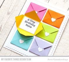 an envelope with some hearts on it and the words tiny birthday note attached to it