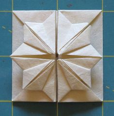 an origami piece is shown on the table