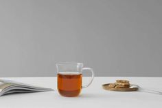 a cup of tea and some cookies on a table