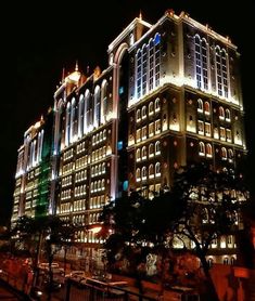 a large building lit up at night with many windows