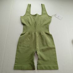 We Wore What Rib Bodysuit In Sage Green Size Small All Measurements Are Approximate And Were Taken Across Item Lying Flat. Length 28" Chest 14" Waist 10.5" Inseam 6" New With Tag, Msrp $98 Fitted Sleeveless Khaki Jumpsuits And Rompers, Seamless Summer Tops For Loungewear, Summer Loungewear Tops In Seamless Fabric, Seamless Fabric Tops For Summer Loungewear, Green High Stretch Jumpsuit For Summer, High Stretch Green Jumpsuit For Summer, Green Seamless Bodysuit For Spring, Casual Green Seamless Bodysuit, Seamless Green Bodysuit For Spring