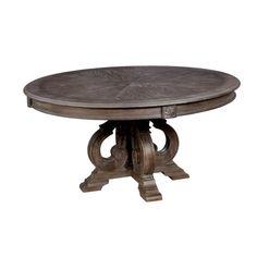 an oval wooden table with two leaves on the base