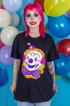 "Noodles The Clown black tshirt. Introducing our latest creepy friends...Noodles & Jasper, The Clown Twins. Both terrifying and adorable, if you like Clowns you're bound to fall in love with this mischievous pair! If you want to wear it oversized we recommend going 1 or 2 sizes up! This is a Grunge Monkey exclusive creation, designed and made in our Chester studio. Sizes S (UK 8 - 10 M (UK 10 - 12),L (UK 14 - 16), XL (UK 16 - 18) XXL (20-22) Measurements; Chest/Bust: S 34/36\"  M 36/38\" L 38/40 Black Fun T-shirt For Costume Party, Playful Halloween T-shirt With Cartoon Print, Fun Black T-shirt For Costume Party, Harajuku Style Top For Halloween, Harajuku Tops For Halloween, Black Fun T-shirt For Casual Party, Fun Black T-shirt For Party, Fun Black Party T-shirt, Harajuku Anime Print Halloween Top