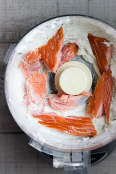 salmon being processed in a food processor to make mashed potatoes and other foodstuffs