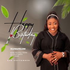 a woman standing in front of a happy birthday card