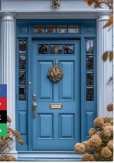 a blue front door with white columns and flowers