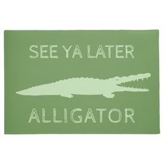 a green door mat with an alligator and the words see ya later alligator on it