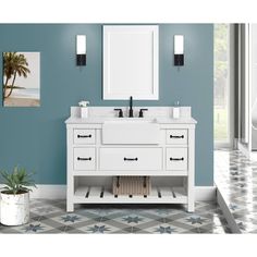 a bathroom with blue walls and a white double sink vanity next to a large window