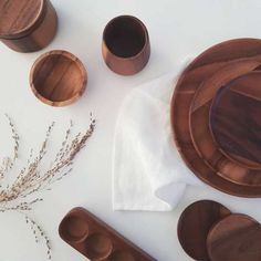 wooden dishes and utensils laid out on a table