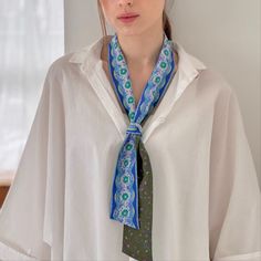 Showcases playful but elegant silk tie scarves in 2 colours, one in pink and the other in blue. One side with the flower leaf confetti scattered, one side with floral motifs with lacey border. These are long enough to go round the neck twice. Simple shape and easy to wear.    Double sided. Silk 100% Digitally Printed  Dry Clean Only Elegant Green Scarves For Summer, Elegant Green Summer Scarves, Elegant Green Scarves For Spring, Elegant Multicolor Silk Neckwear, Elegant Green Floral Print Silk Scarf, Elegant Blue Silk Scarf For Spring, Elegant Green Floral Silk Scarf, Chic Green Silk Scarf Gift, Chic Green Silk Scarf For Gift