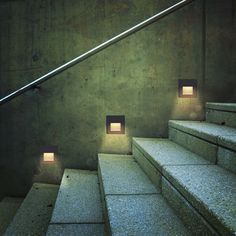 some steps with lights on them in a building