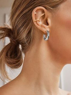 The perfect lightweight chunky silver hoops are just a click away. Our Dalilah Earrings are a must-have jewelry essential for your arsenal. Thick tubes of metal are crafted in a timeless hoop shape and topped off with a comfortable post-back closure. Lightweight and easy to layer (if you so choose), you're bound to reach for these staples again and again. Silver Hoop Ear Cuff, Everyday Silver Metal Huggie Earrings, Silver Metal Ear Cuff For Everyday, Trendy Silver Huggie Ear Cuff, Silver Huggie Ear Cuff For Everyday Wear, Everyday Silver Huggie Ear Cuff, Trendy Silver Hoop Cartilage Earrings, Everyday Silver Hoop Wrap Earrings, Nickel-free Silver Hoop Ear Cuff