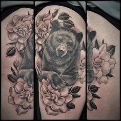 a black and white photo of a bear with flowers on it's back shoulder