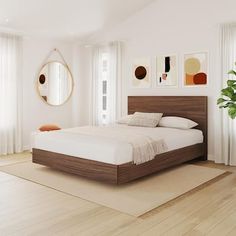 a bedroom with white walls and wooden floors