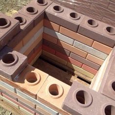 a pile of bricks sitting on top of a wooden pallet with holes in them