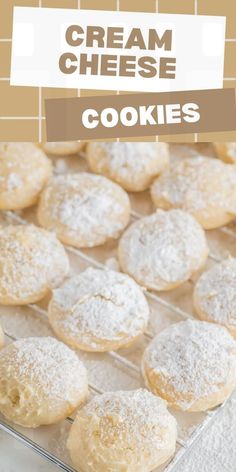 a close up of some cookies on a tray with the words cream cheese cookies above it