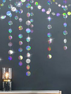 the wall is decorated with multicolored bubbles and sparkles hanging from it's ceiling