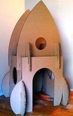 a cardboard castle made to look like a rocket ship