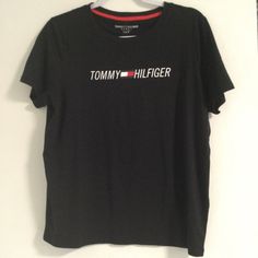 Black Tommy Hilfiger Short Sleeve Tee Tommy Hilfiger Black Crew Neck Top, Tommy Hilfiger Short Sleeve T-shirt For Summer, Cheap Sporty Tommy Hilfiger T-shirt, Tommy Hilfiger Casual Cotton T-shirt, Tommy Hilfiger Black Crew Neck T-shirt, Tommy Hilfiger Graphic Tee Short Sleeve T-shirt, Tommy Hilfiger T Shirt, Tommy Hilfiger Shorts, Tommy Hilfiger Text Print Cotton T-shirt