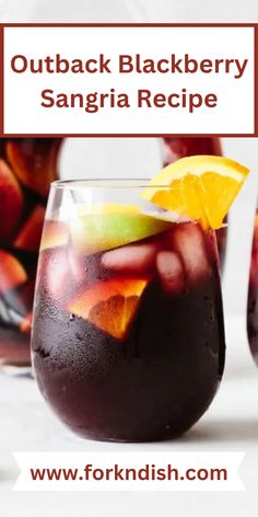 two glasses filled with black berry sangria and orange slices on the rim, sitting next to each other