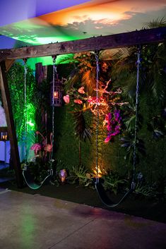 a room filled with lots of plants and lights