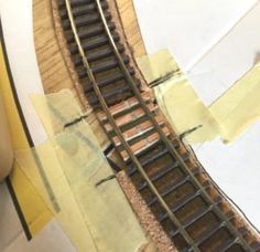 a model train track is shown on the table