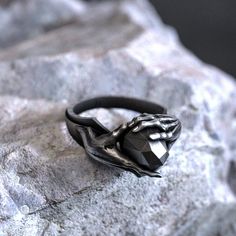 Unleash your inner psychic power with our mesmerizing Ring of Telekinesis. This handcrafted 925 sterling silver piece showcases an intricate design inspired by the mystical concept of telekinesis, featuring swirling patterns and delicate engravings. This unique, unisex ring is a must-have for any sci-fi or fantasy fan, or anyone who appreciates the allure of the unknown. The exquisite craftsmanship and polished finish make it a captivating accessory for any occasion. Available in various sizes f Gothic Sterling Silver Rings For Gift, Symbolic Black Hand Cast Jewelry, Spiritual Hand Cast Promise Rings, Spiritual Black Jewelry For Promise, Spiritual Stainless Steel Ring, Black Symbolic Jewelry For Promise, Mystical Sterling Silver Jewelry For Promise, Mystical Sterling Silver Rings As Gifts, Mystical Sterling Silver Rings For Gift