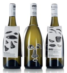 three bottles of wine with faces on them