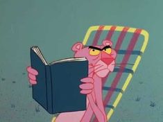 pink panther reading a book while sitting in a chair