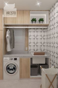 a washer and dryer sitting in a room next to a shelf with plants