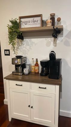 there is a coffee bar on top of the cabinet