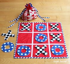 a red, white and blue quilted board game on the floor