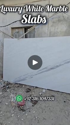 a white marble slab is shown in front of a building with the words luxury white marble slabs