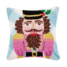 a decorative pillow with an image of a man wearing a top hat and holding a christmas tree