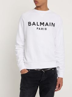 Find BALMAIN Logo Printed Sweatshirt on Editorialist. Reglan sleeves. Ribbed cuffs and hem. Printed front panel. Model is wearing a sizeM Luxury Cotton Crew Neck Sweatshirt, Classic Long Sleeve Logo Sweatshirt, Designer Cotton Sweatshirt With Ribbed Cuffs, Designer Crew Neck Sweatshirt With Logo, Designer Crew Neck Sweatshirt With Logo Detail, Designer Cotton Sweatshirt With Logo Detail, Designer Long Sleeve Sweatshirt With Logo, Luxury Tops With Logo Detail For Fall, Luxury Logo Detail Tops For Fall