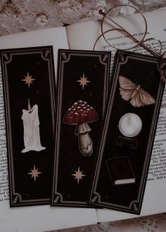 three bookmarks with pictures of clothing and mushrooms on them