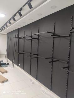 an empty room with shelves and tools on the wall