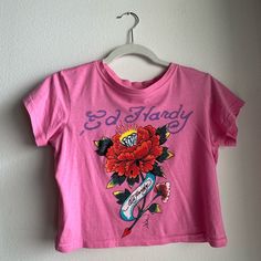 Pink Ed Hardy Crop Top! Super Perfect And Matches With Everything Never Worn Before Vintage Urban Outfitters T-shirt For Summer, Urban Outfitters Trendy Cotton Tops, Trendy Urban Outfitters Cotton Top, Retro Cotton Tops By Urban Outfitters, Retro Cotton Tops From Urban Outfitters, Urban Outfitters Letter Print T-shirt For Spring, Urban Outfitters Fitted Vintage Top, Retro Letter Print Tops By Urban Outfitters, Urban Outfitters Retro Letter Print Tops