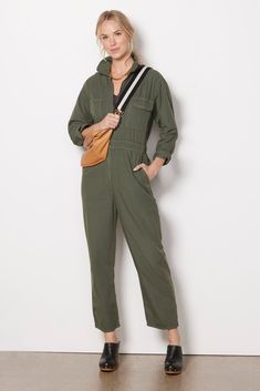 A one-and-done piece with wear-everywhere style. Crafted in cotton canvas, this long sleeve jumpsuit by Rivet Utility features a flattering cinched waist, front zipper closure, and ankle-length straight leg. Dress it up with heels, or keep it casual-chic with sneakers. | RIVET UTILITY Women's Looker Jumpsuit, Size Small, Green Utility Jumpsuit, Fall Closet, Utility Pants, Long Sleeve Jumpsuit, Long Jumpsuits, Cropped Style, Fall Shopping, Tee Dress, Cinched Waist