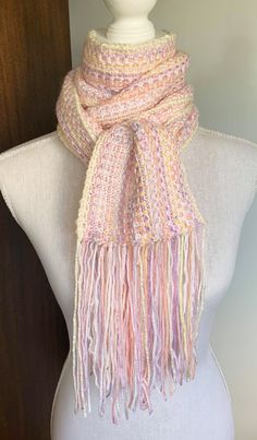 "Super long, beautiful knit scarf, in a variety of pinks, lilacs, whites, creams and peaches to make up this piece. Knit in a linen stitch to give the colours the chance to shine. Long enough to wrap a few times or just leave it long for a statement. This piece measures 16cm/6\" wide, 163cm/ 64\" long. Hand made, by me, who loves her work. Thanks for viewing my shop Lisa" Pink Scarves For Spring, One Size, Pink Bohemian Scarves For Fall, Pink Bohemian Scarf For Fall, Pink One Size Scarf For Spring, Pink One Size Scarves For Spring, Pink One-size Scarves For Spring, Handmade White Scarves For Spring, Pink Knitted Fall Scarf, Pink Crochet Scarves