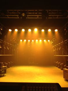 an empty stage with lights on it