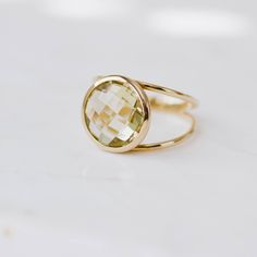 Lemon Quartz ring with double band in 14K solid gold. A modern and timeless stone ring with a natural quartz gemstone. A perfect gem gold ring for women, dainty and subtle that adds glam to every outfit. The best for her. 100% handcrafted with love! D E T A I L S ● Metal: 14K solid gold or 14K white gold or 14K rose gold ● Gemstone: Lemon Quartz, briolette cut ● Stone Diameter: 10mm (0.4in) or 12mm (0.5in) R I N G ∙ S I Z I N G For General Reference: ● we use standard US Ring Sizing ● an average Modern Gold Crystal Ring With Gemstone, Elegant Gold Rings With Green Amethyst, Elegant Gold Ring With Green Amethyst, Modern Gold Gemstone Birthstone Ring, Modern Gold Birthstone Ring With Gemstone, Modern Gold Citrine Rings, Formal Gold Rings With Green Amethyst, Modern Yellow Gold Ring With Round Stone, Modern Gold Birthstone Ring With Round Cut