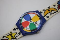 Vintage 1993 Gents Swatch watch, GN134, 'Space People'.  The watch is NEW OLD STOCK and Never Worn, working 100%, with the original strap. Please check the photos for details. I tested its function and it is working 100% It will be supplied without battery. At checkout, you have the option to order it with a battery mounted. Width of the case without the crown: 33mm I have more vintage Swatch items for sale, do not forget to take a look at my other items! Shipping mentioned is for shipping WITH track/trace through Irish Post (AnPost) in a well-padded envelope. I ship worldwide, if your country is not listed, please contact me, I can add it I have many years of experience in (international) shipping, you can rest assured that all my items are packed as if they were my babies and that I also Kidcore Fashion, Swatch Watch, Be My Baby, The Crown, Wrist Watch, The 100, The Originals, Music Clothes