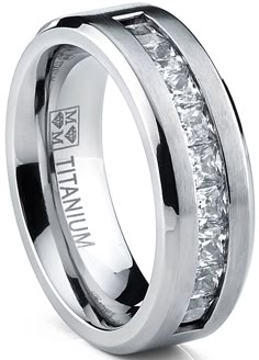 a white gold wedding ring with princess cut diamonds in the center and channeled edges