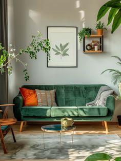 a living room filled with green furniture and lots of greenery on the wall above