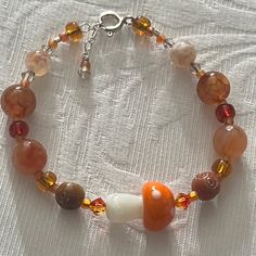 Have You Been To The Mushroom Festival? Adorable Orange Glass Mushroom Focal Bead Bracelet Swarovski Crystals Orange Glass Mushroom Bead Natural Stone Sterling Silver Adjustable Closure Nwt All Pieces Created By Hand At The Studio. . Smoke And Pet Free Happy To Answer Any Questions. Fall Theme Bracelets, Fall Bead Jewelry, Natural Stone Bracelet Ideas, Mushroom Bracelet Pattern, Fall Beaded Jewelry, Earthy Bracelets, Fall Bracelet Ideas, Cute Bead Bracelet, Cottagecore Bracelet