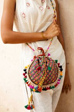 This beautiful potli bag is a creation of the women working at Kalaraksha Tote Crochet, Sac Diy, Potli Bag, Ethnic Bag, Stil Boho, Potli Bags, Embroidery Bags, Handcrafted Bags, Boho Bags