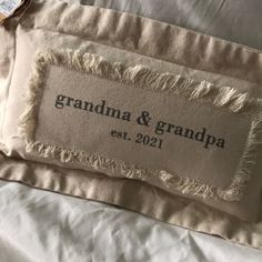 the label on this pillow says grandma and grandpa est 2091, but it's not for sale